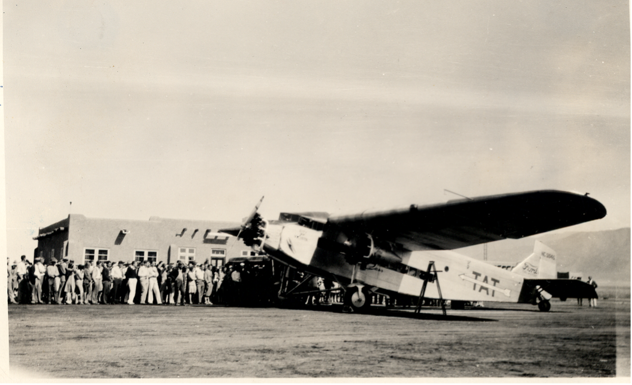 A Transcontinental Air Transport Ford Tri-motor parked at the TAT terminal at the Albuquerque Airport.