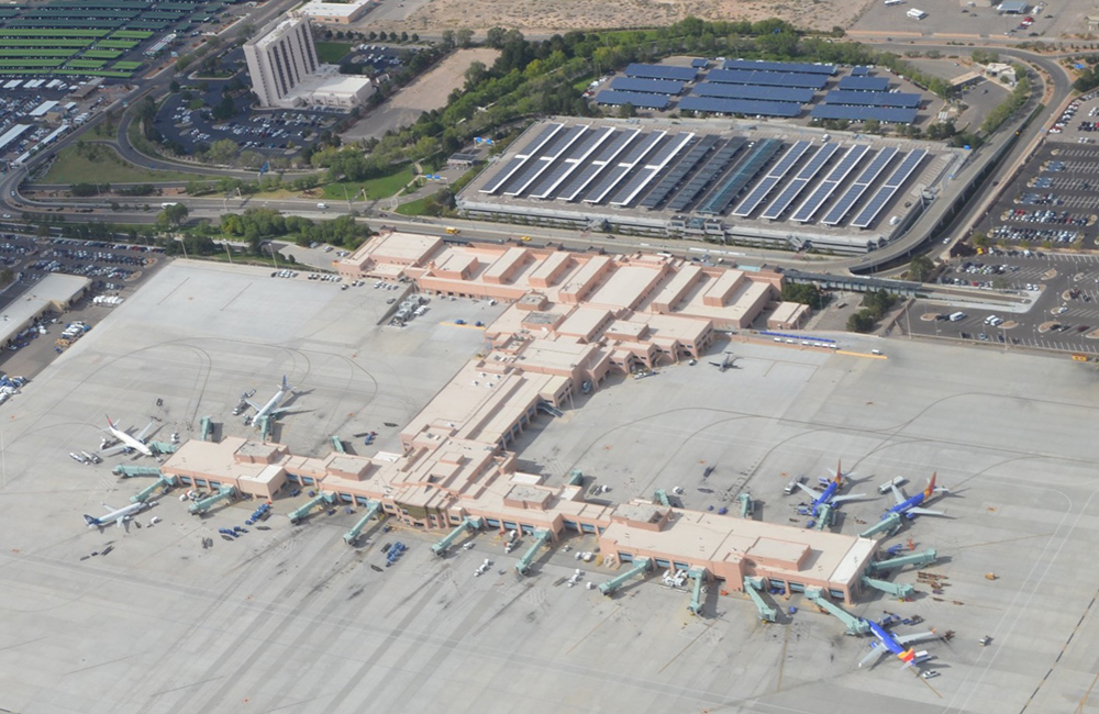 Albuquerque International Sunport terminal in 2018 showing the extension of the A concourse (lower right), the expansion of the security checkpoint (center), and the removal of the west wing gates (upper left). All tarmac has been reconstructed with concrete.
