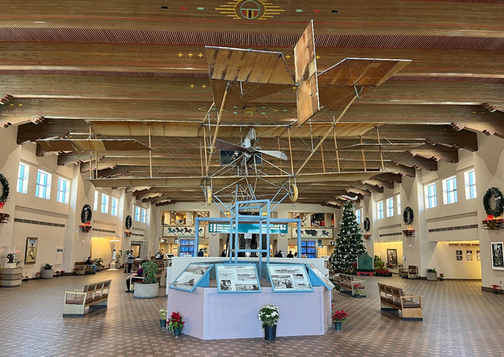 The Great Hall inside the terminal features an Ingram-Foster biplane from 1914. The hall is seen here decorated for the Christmas holiday in 2022.