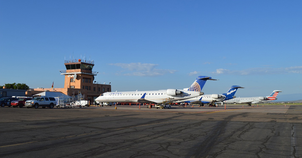 The ramp of the Santa Fe airport in 2020 with three CRJ-700 regional jets.