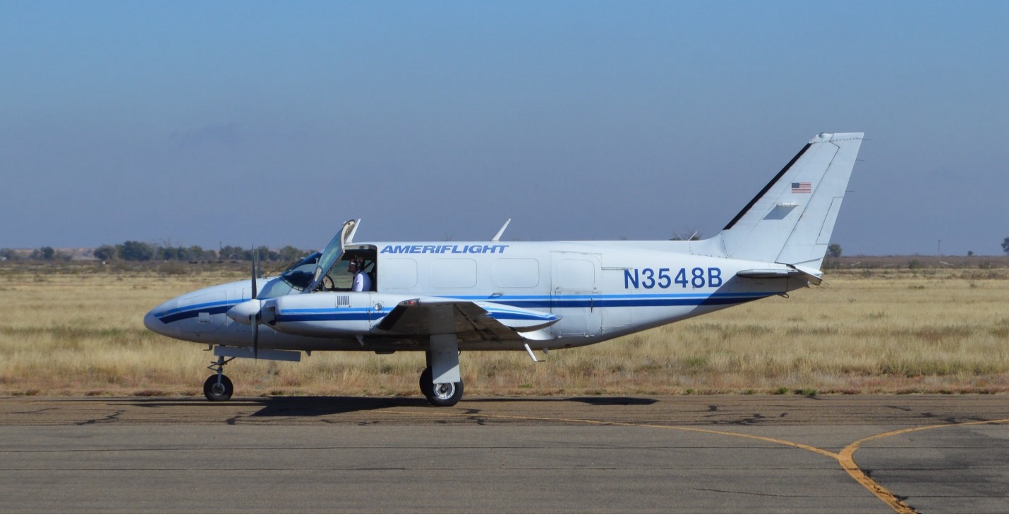 The-Taos-Regional-Airport-terminal-building-and-a-Taos-Air-Fairchild-Dornier-328-regional-jet-in-2019